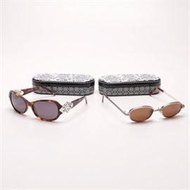 Brighton Sunglasses with Cases: A collection of sunglasses by Brighton. This collection features a pair of handmade over-sized sunglasses with tortoise shell frames and ornate silver tone embellishments to the temples, and a pair of sunglasses with tinted lenses, and silver tone frames embossed with scroll-work and linear patterns. The Brighton trademark is presented to each temple. These sunglasses come complete with black and white branded cases.