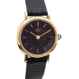 Concord 14K Yellow Gold Black Leather Wristwatch: A Concord 14K yellow gold black leather wristwatch featuring a round case housing a black dial with gold tone hour indicators, two hands, and a black leather bracelet.