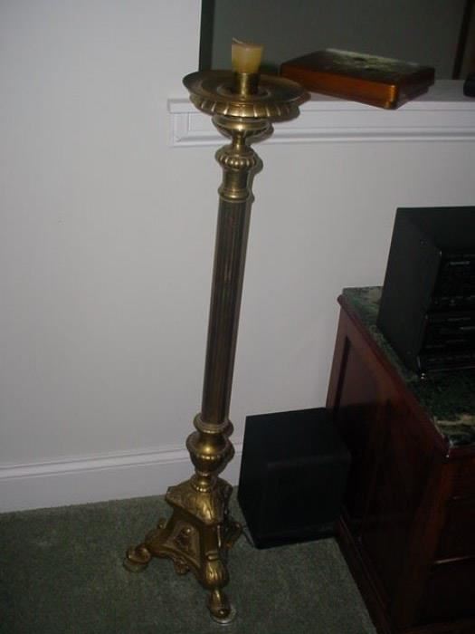 There are a pair of these ornate brass candleholders