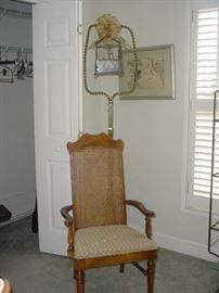 Another of the side chairs, bird cage, and art