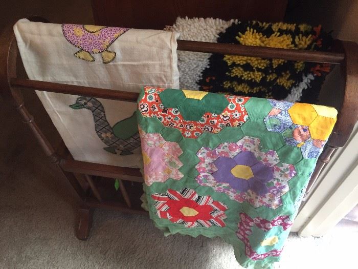 Antique blanket tops, quilt rack