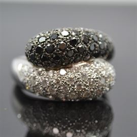 18K White Gold 2.48 CTW Black and White Diamond Ring: An 18K white gold 2.48 ctw diamond ring. This unique bypass style ring features black and white diamonds over a smoothly polished shank.