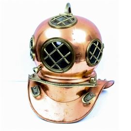 Copper and Brass Diving Helmet: A copper and brass diving helmet. This piece features copper construction with brass hardware accents. It has four brass caged glass viewing ports and is unmarked.