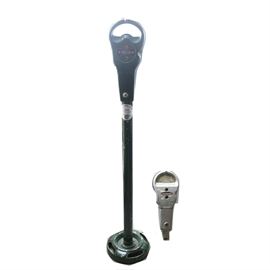 Vintage Parking Meters: A pair of parking meters. One is painted green and on a matching stand. it has a tag for the Chicago loop. The second is silver, is not on a post and has a 2 hour limit.