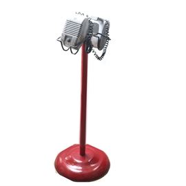 Vintage RCA Drive-in Speakers: A vintage RCA drive-in theater speaker pair. The speakers are aluminum and are hanging on an aluminum mount. This is sitting on a red painted stand.