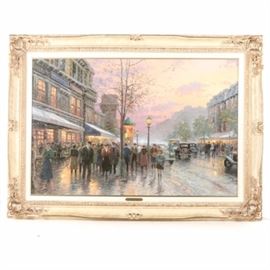 Thomas Kinkade Giclee Print on Canvas "Boulevard Lights, Paris": A giclee print on canvas titled Boulevard Lights, Paris, from the series City Impressions by renowned American artist Thomas Kinkade (1958-2012). This Impressionist style piece depicts a street in Paris after an Autumn rain, with a crowd of people walking along the sidewalk, cars passing, and warmly lit buildings against a light purple and orange sunset. The work is signed in plate and by hand, and is presented under a liner with an engraved brass tone plaque, without glass, in a decorative white and gold tone frame. A hanging wire and certificate of authenticity are affixed to the verso.