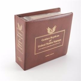 22K Gold Replicas of United States Postage Stamps: A collection of 22K gold replicas of United States postage stamps. This collection issued by the Postal Commemorative society features a first day of issue United States postage stamp from 1980 and 1981 along with a 22K gold replica of the same stamp presented in a black frame in an envelope with explanatory notes on the back side of the envelope. Each envelope is housed is a plastic sleeve with the sleeves in a brown three ring binder.