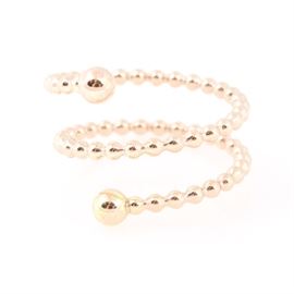 14K Yellow Gold Beaded Wrap Ring: A 14K yellow gold beaded wrap ring. The ring wraps two full twists and terminates with gold balls at each end.