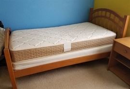 One of two twin beds or half of a bunk bed set