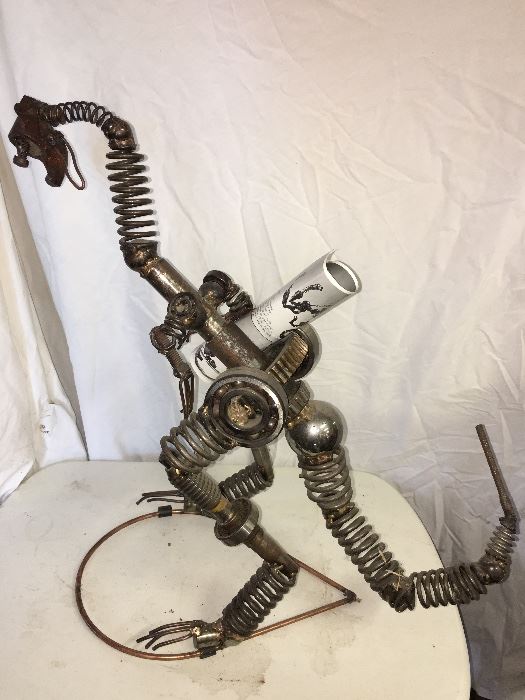 Metal sculpture by Glenn Donovan. A work of art approximately 2' tall. Retail cost $500.