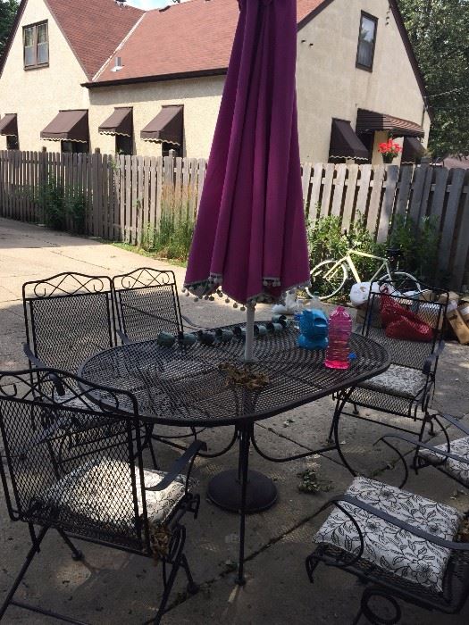 black wire, sturdy patio table with six chairs that rock and swivel 