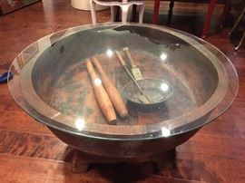 carved solid wood bowl  shape glass topped table         
inside - antique household items 