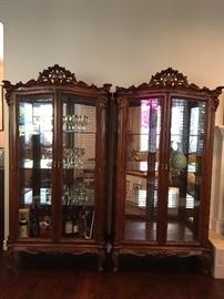Italian solid wood curios.  W 40" x H 78"                             carved thick solid wood, 3 glass shelves and back mirrored.                                                                                  matching w/ previous dining set and buffet