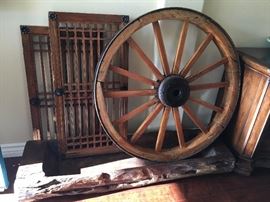 antique decoration items.  old Asian house door,  wood and iron wheel with sealing,  long solid wood bowl