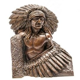 1977 Sid Burns Bronze Sculpture "Pride of Race": A 1977 bronze sculpture titled Pride of Race by Sid Burns (1916 – 1979). The work depicts an American Indian with a feathered headdress draped in a garment also covered with feathers and textured to resemble fur. The piece is dated 1977, signed Sid Burns, titled Pride of Race and numbered 16 of 24 to its left side.