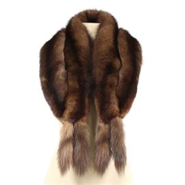 Russian Sable Fur Scarf: A Russian sable fur scarf. This plush piece features Russian sable pelt construction with a frog closure. Tag to interior reads “Blums Vogue Chicago”.