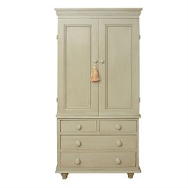 Painted Wood Armoire: A painted wood armoire. The grey painted wood armoire features a cornice molding top, two paneled doors and four drawers. The cabinet doors open to two shelves with a hole in the back to run wires. The unit includes a extra shelf and the shelves are adjustable. The drawers feature wood knobs painted to match. The armoire stands on four toupie feet and includes the tassle.