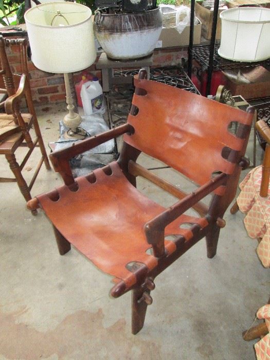 Awesome vintage leather and wood frame chair with wood pins.
