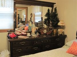 dresser, statue of Mary, ship clock & lamp