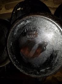 Large selection of wrought iron cookware