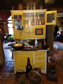 Sweet primitive kitchen cabinet.  Glass doors and multiple drawers