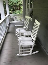White rockers, swing and side table