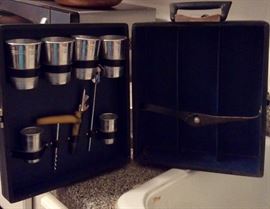 Travel bar set , room for 3 bottles of liquor or wine, that should do it 