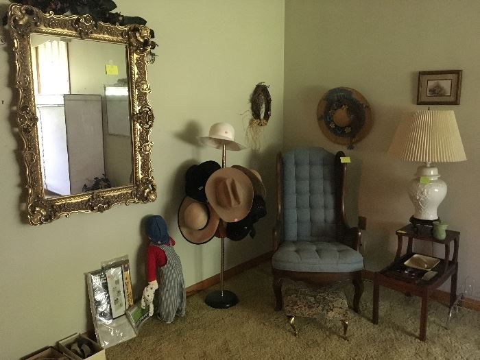 ornate mirror, hats, chair and step side table