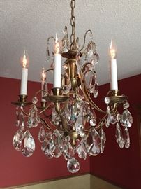 Crystal and antique brass chandelier. 21"X22" plus length of chain. Like new condition.