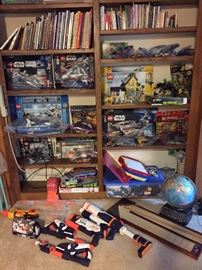 Kids' books and toys: 12 complete lego sets with original boxes, Collector lego mini figures, Smart Globe, Illuminated Globe, WII Fit Plus, Old School Shuffle Board Set, Nerf Guns, Water Guns.