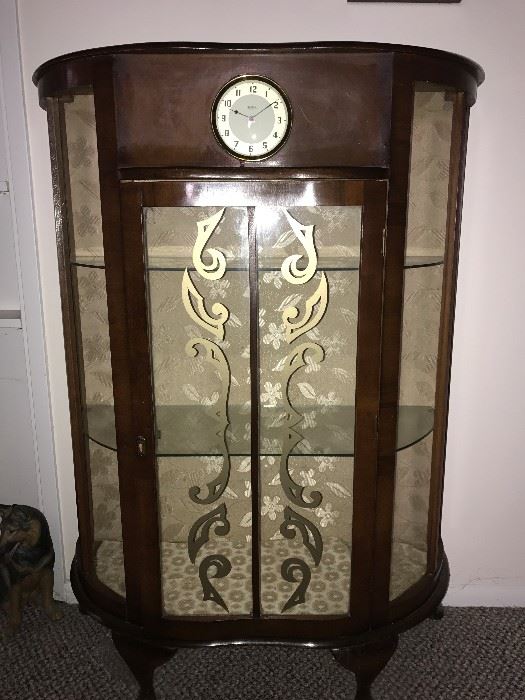 Small antique curio cabinet with inset clock