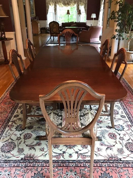 Elegant Dining table with leaves and pads, upholstered chairs