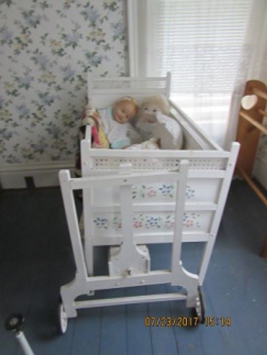 the rocking cradle can be wound up and it gently rocks the baby to sleep.  