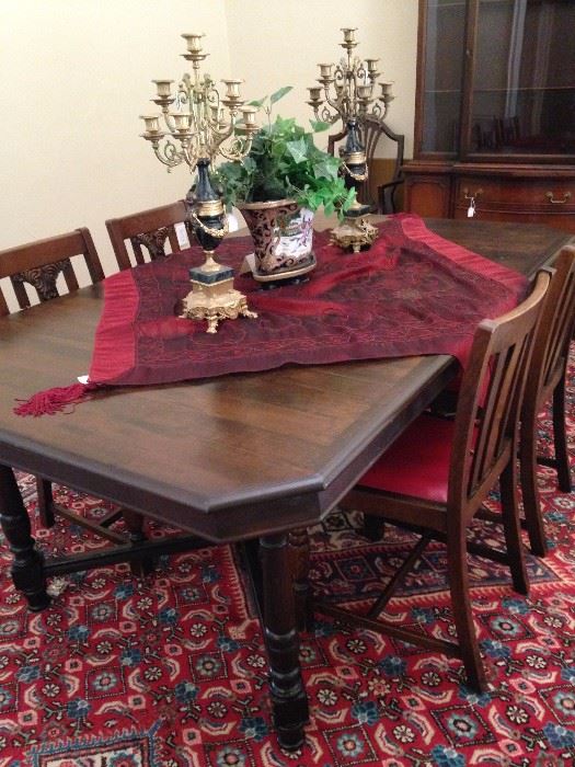 Antique dining table; gorgeous candelabras; four antique chairs sold separately from the table