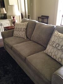 Like-new 3-cushion sofa and decorative pillows