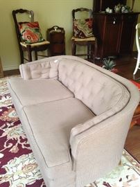 Small tan 2-cushion sofa