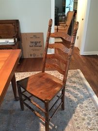 Six vintage ladder-back oak chairs.  Being sold separately.