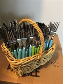 several sets of blue & green flatware