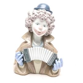 Lladró "Fine Melody" Figurine #5585: A Lladró figurine titled Fine Melody, #5585. The figurine depicts a clown playing an accordion. His expression is gloomy under his smiling clown make up. The figurine was sculpted by Francisco Catala in 1989 and later retired in 1994.
