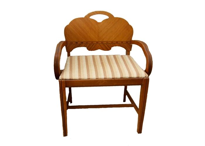 Vintage Art Deco Chair: A vintage Art Deco chair. This lovely chair is made of wood with a mixture of maple veneers and inlaid trims. It features a scalloped arched seat back, curved arms, straight reeded lags and upholstered seat in a striped beige fabric. This is a companion to 17CIN037, 17CIN038 and 17CIN039.