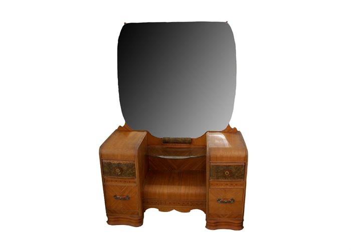 Vintage Art Deco Vanity with Mirror: A vintage Art Deco lady’s vanity with mirror. This unique piece is made of wood with a mixture of burled veneers and inlaid trims. It features a center mirror over recessed floral etched glass shelf and four drawers with dovetail joinery. Gold colored plastic handles and aged brass tone knobs accent this piece nicely. This item is a companion to 17CIN037, 17CIN039, 17CIN040.
