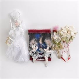 Collection of Van Craig Ornaments and Figurines Including "The Vantastiks": A collection of Van Craig figurines and ornaments. Includes three Vantastiks ornaments by Kurt Adler in the style of the “Roaring 20s” including one unopened in its original box, a Snow Queen Pixipyes ornament with tag, and a figure with long legs and a leafy mane holding a red rope.