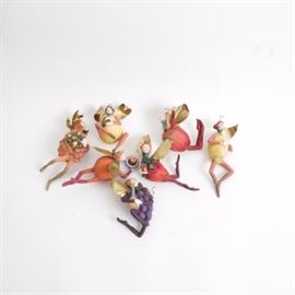 Department 56 "Tutti-Frutti" Ornaments: A set of seven Tutti-Frutti ornaments by Department 56. Each features a handcrafted resin composition and depicts a different personified fruit fairy with gold-tone metal wings. Includes a pineapple, an orange, a strawberry, a pear, a lemon, a grape, and an apple. The plum is missing. All are hand-painted and present in original boxes.