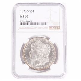 NGC Graded 1878 S Morgan Silver Dollar: An 1878 S silver Morgan dollar graded MS 63 by NGC. Designer: George T. Morgan. Mintage: 9,774,000. Metal Content: 90% silver, 10% copper. Diameter: 38.1 mm. Weight: approximately 26 grams.