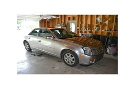 2007 Cadillac CTS Sedan: A 2007 4-door Cadillac CTS sedan; VIN is 1G6DM57T470164447 and mileage is 105,919. Features include a 2.8 liter engine and automatic transmission. The interior features grey leather upholstery. The vehicle is equipped with automatic windows, locks and sunroof.