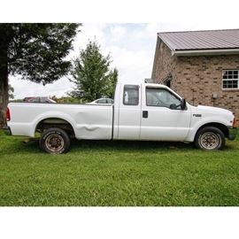 1999 Ford F250 Pickup Truck: A 1999 Ford F250 full size pickup truck; VIN is 1FTNX20L9XEB99439 and odometer reads 198,167 miles. The 2-door truck is white with a V8 engine and manual transmission. The interior of the car features grey leatherette upholstery and dash. The vehicle is equipped with manual windows and locks.