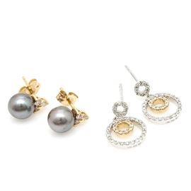 14K White and Yellow Gold Diamond and Pearl Earrings: A set of 14K white and yellow gold diamond and pearl earrings. The first pair of earrings feature blue cultured pearls with diamond accents to the top and the other pair features two circles in a drop down setting encrusted in diamonds.
