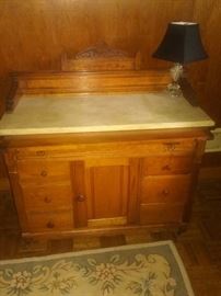 Antique bird's eye maple knee hole desk with marble top..pull out desk top under marble..door opens for knee space
