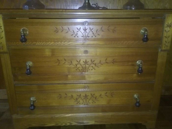 Knapp construction oak dresser with original brass and wood teardrop pulls...carved drawer fronts...1870-1900