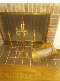 Antique BRASS fireplace set...screen with chain pull net..brass andirons..brass tools..brass wood holder..also log holder in fire place